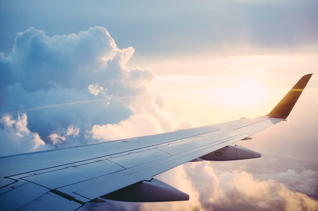 Airplane wing amongst the clouds