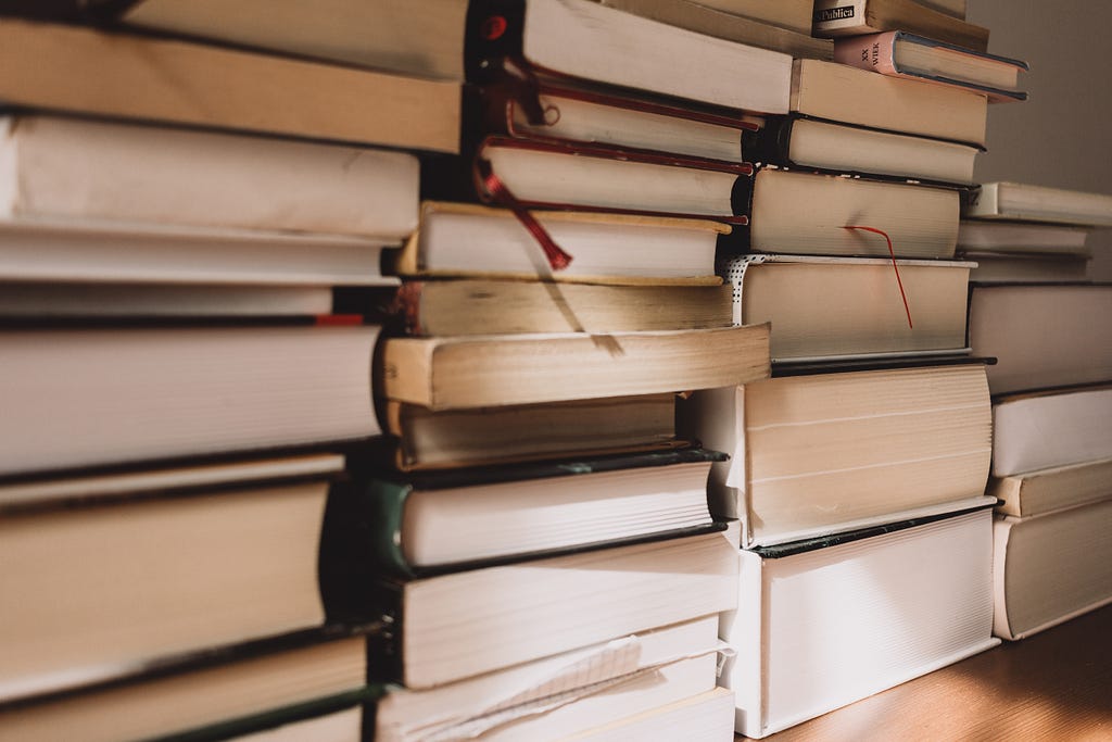 Several stacks of books with bookmarks