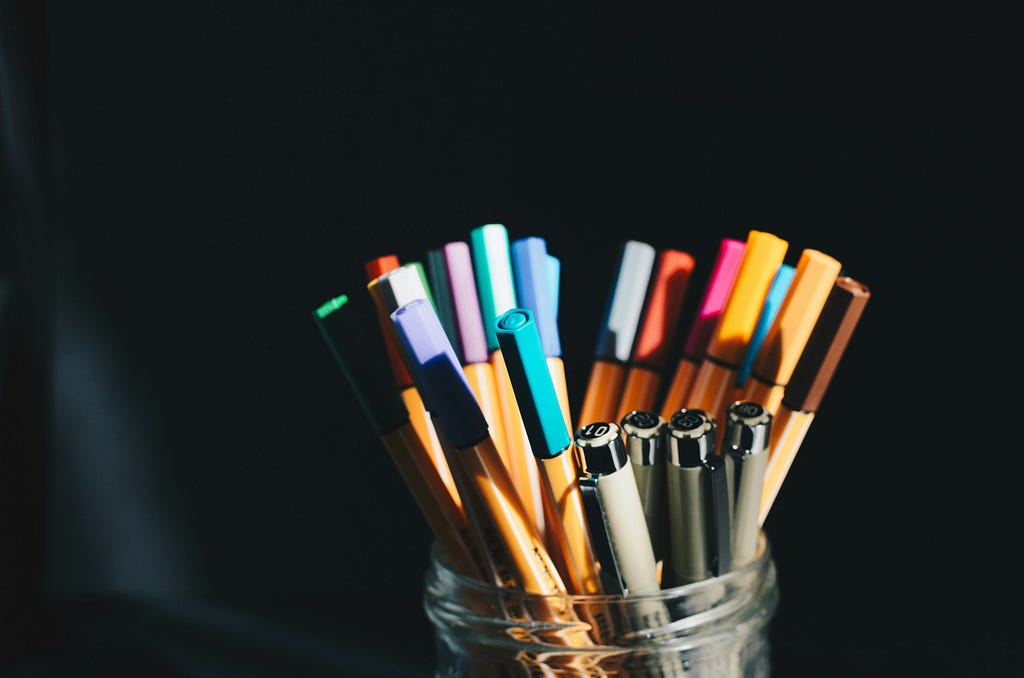 Photo of some nice-looking pens in a jar.