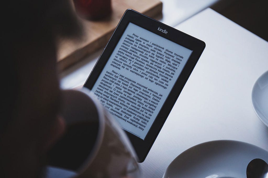 Image of a person holding an eBook