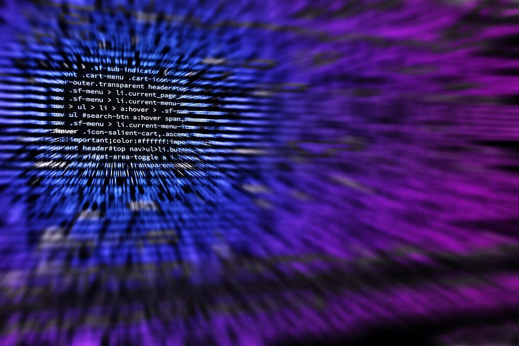 Blue and purple code slightly blurred on a computer screen