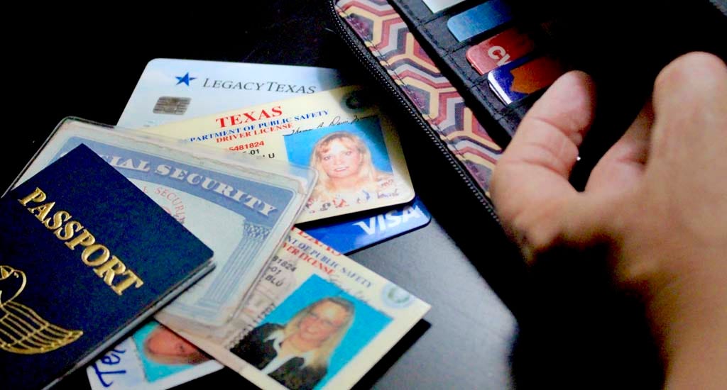 Fake IDs scattered on countertop