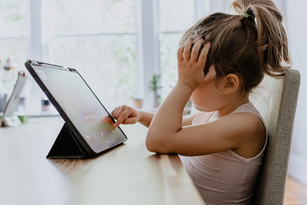 Frustrated child looking at screen
