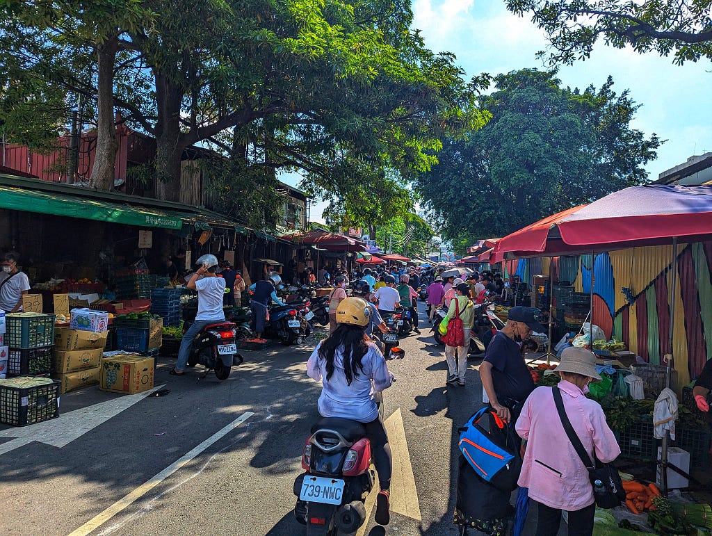A busy street market full of people.