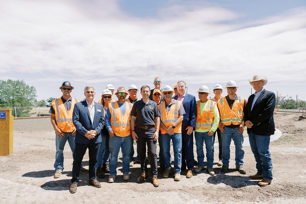 Secretary Buttigieg meets with WYDOT workers at the Highway 30 project site
