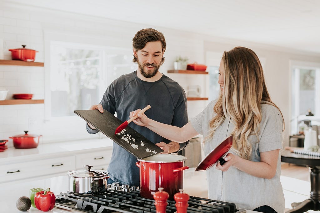 Couple in the kitchen — Best Ways To Lose Weight — RumboMag — Maintaining a healthy weight is important for overall health and well- being