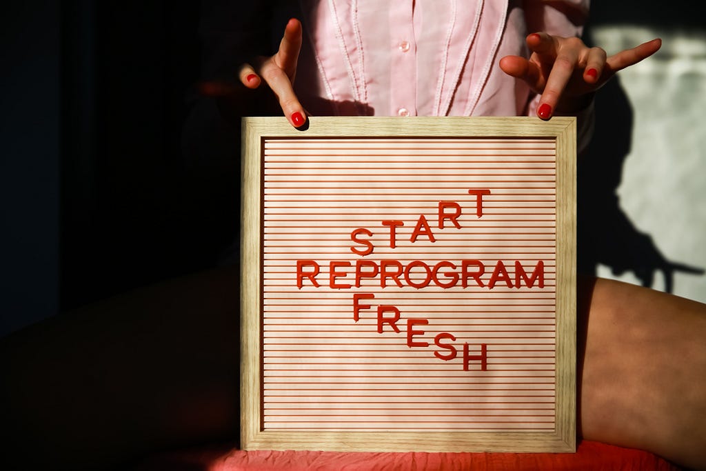 sign saying start fresh reprogram
