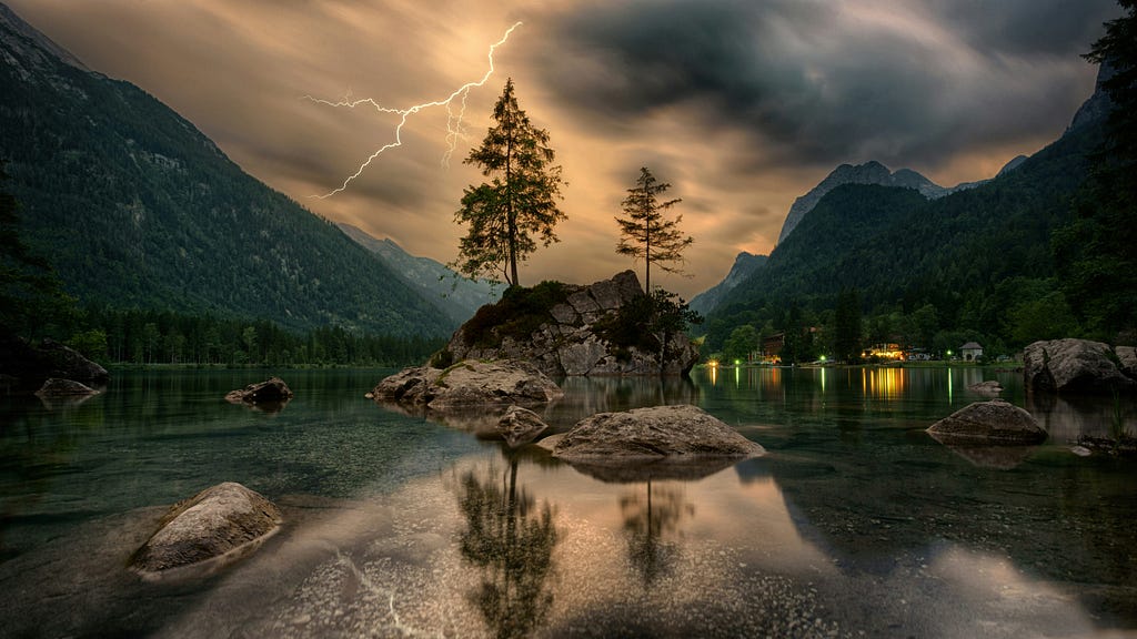 Still waters with lightning in the background