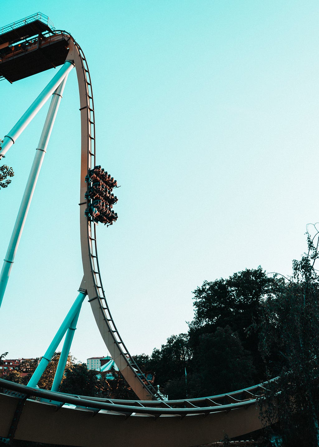 People going down on a ride of roller coaster