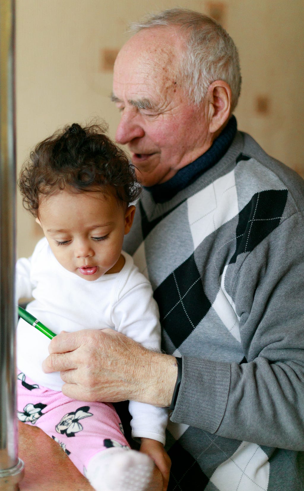 Grandfather playing with a young kid