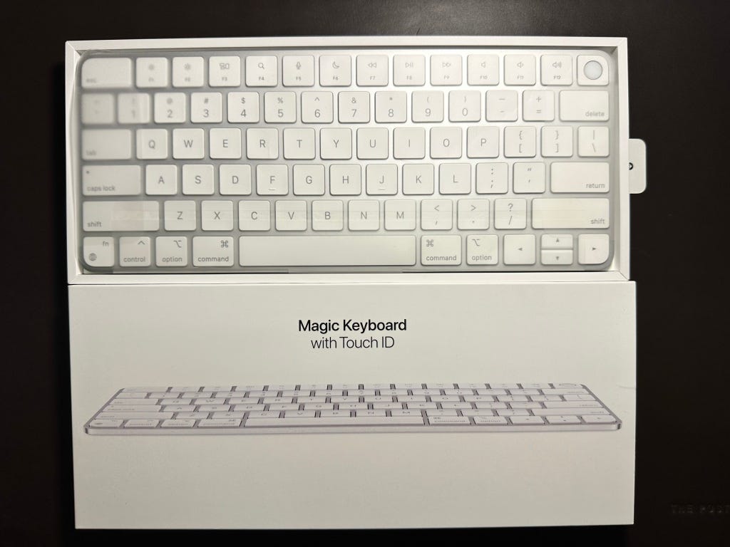 Magic Keyboard next to the front side of the box