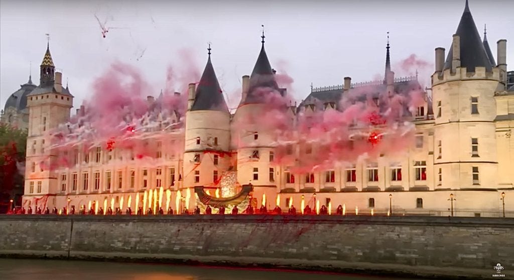 Pyrotechnics and red smoke can be seen in front of Paris’ Conciergerie palace as part of Gojira’s performance during the opening ceremony.