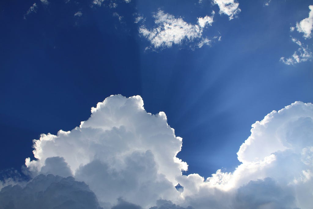 White clouds in a bright blue sky