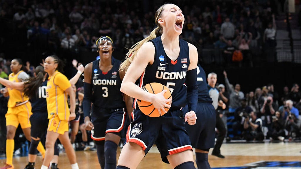 Paige Bueckers celebrates UCONN’s win over USC in the Elite Eight