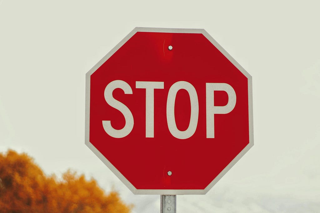 The picture shows a big red stop sign symbolizing danger.