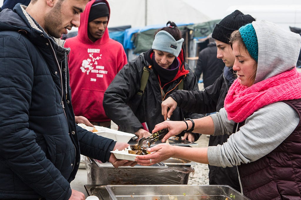 Amelia Burr quit her job to work full-time at Calais Kitchens. “We’ve tried to unify it,” she says. “Kitchens serving hot meals every day. Line distributions. Food going out for refugees to cook themselves.”