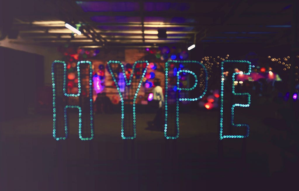 A neon sign that spells “HYPE”