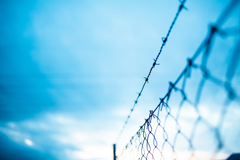 A fence with barbed wire