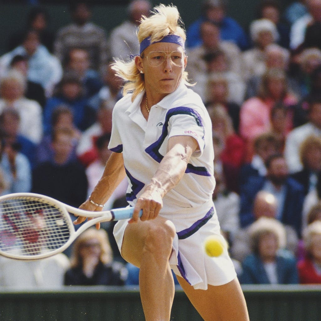 Martina Navratilova hits returns a shot with her backhand