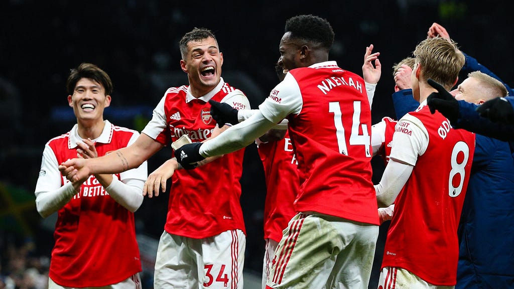 Arsenal’s Granit Xhaka celebrates with team mates after the Premier League match between Tottenham Hotspur and Arsenal in January 2023