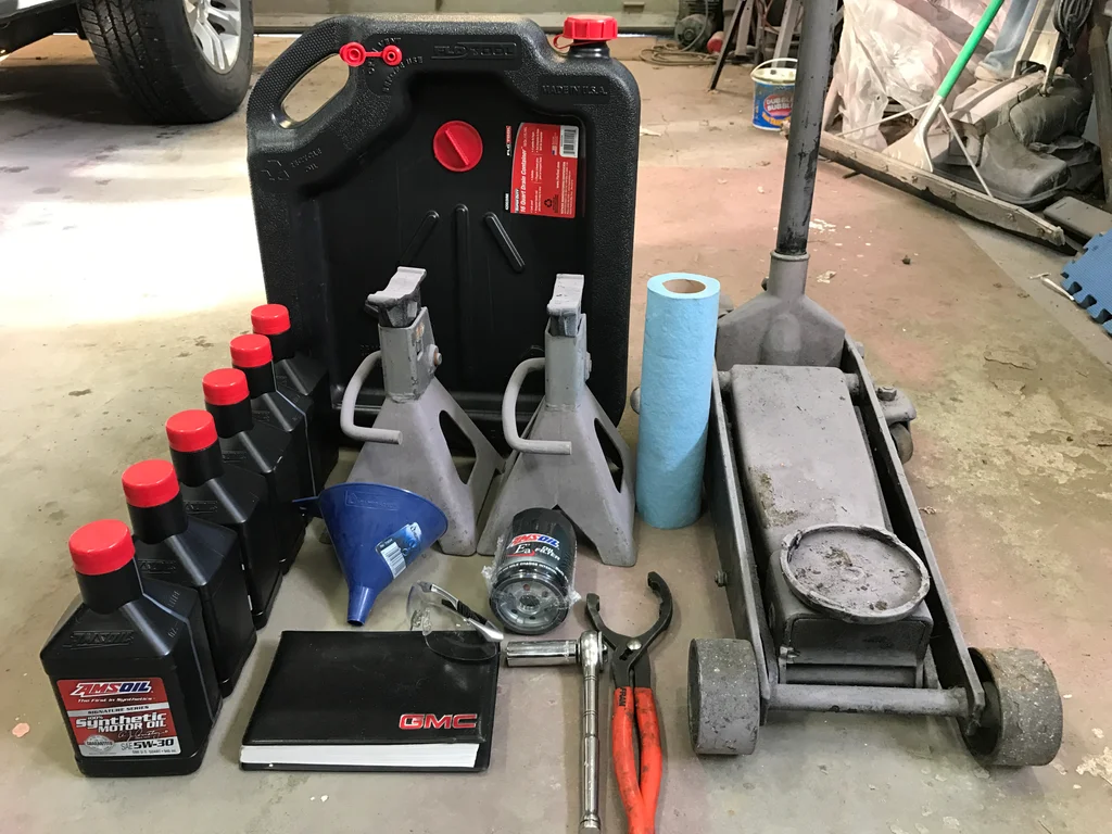 Tools needed for an oil change, jack stands, jack lift, and oil