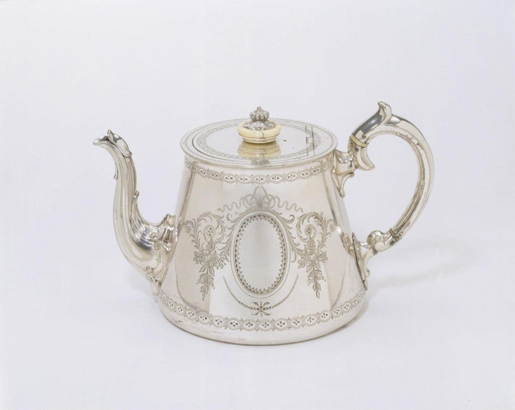 An exquisite electroplated nickel silver teapot with ivory additions, manufactured by Elkington & Co. in Birmingham, 1857.