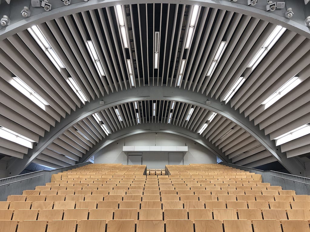 An empty auditorium: is the future of events a firm hybrid between physical and virtual?