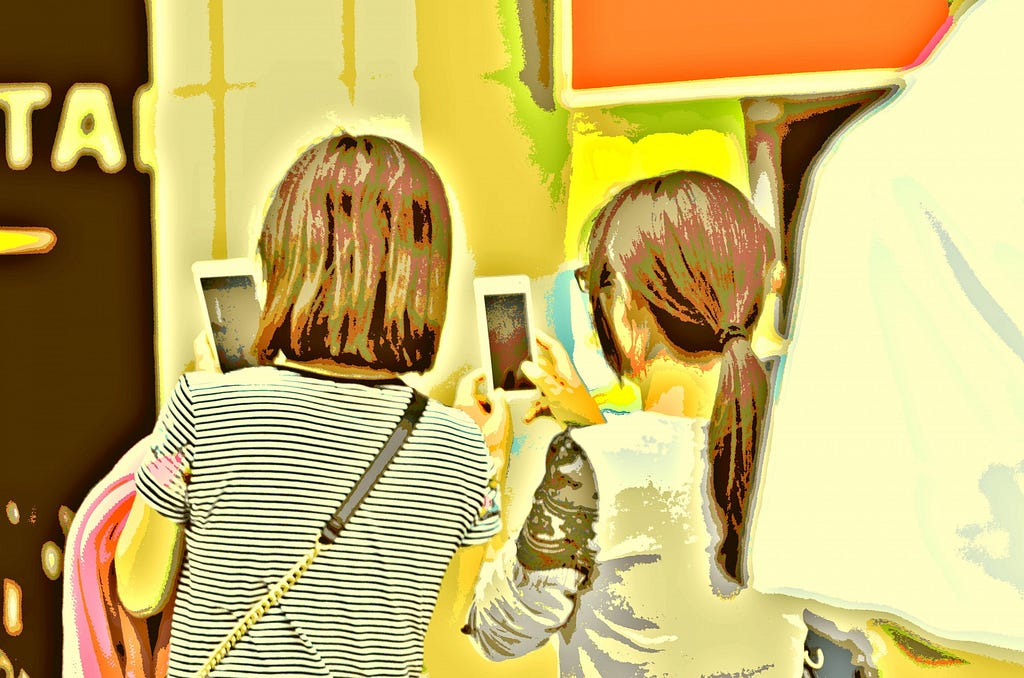 A drawing of the back of two girls taking pictures on their smartphones.