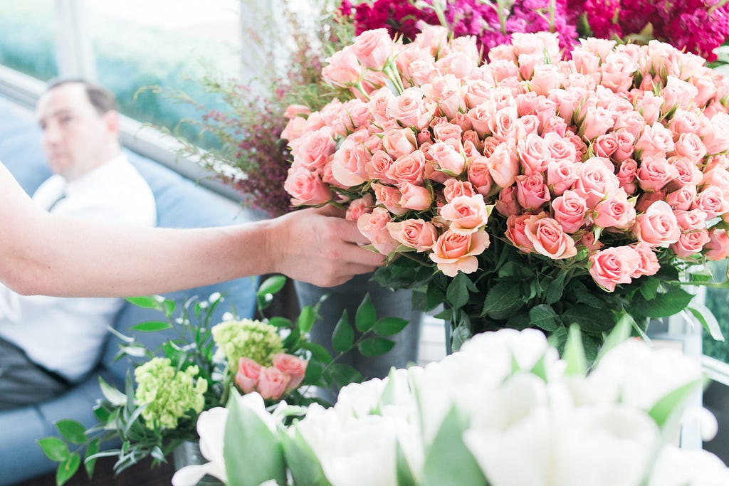 Nicole Spencer picking pray roses during Alice's Table workshop in Jacksonville, Florida