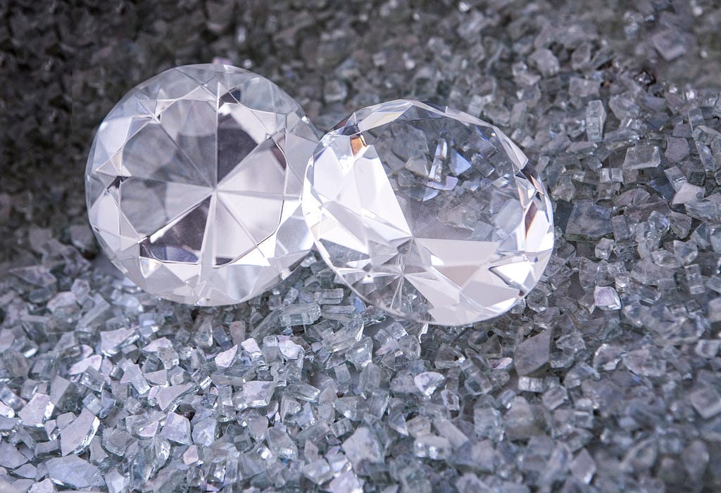 A picture of two diamonds surrounded by smaller crystals.