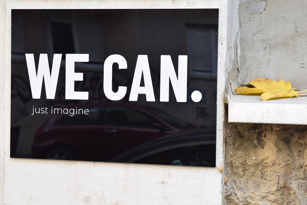 Photo of a sign that says “We Can. Just imagine”