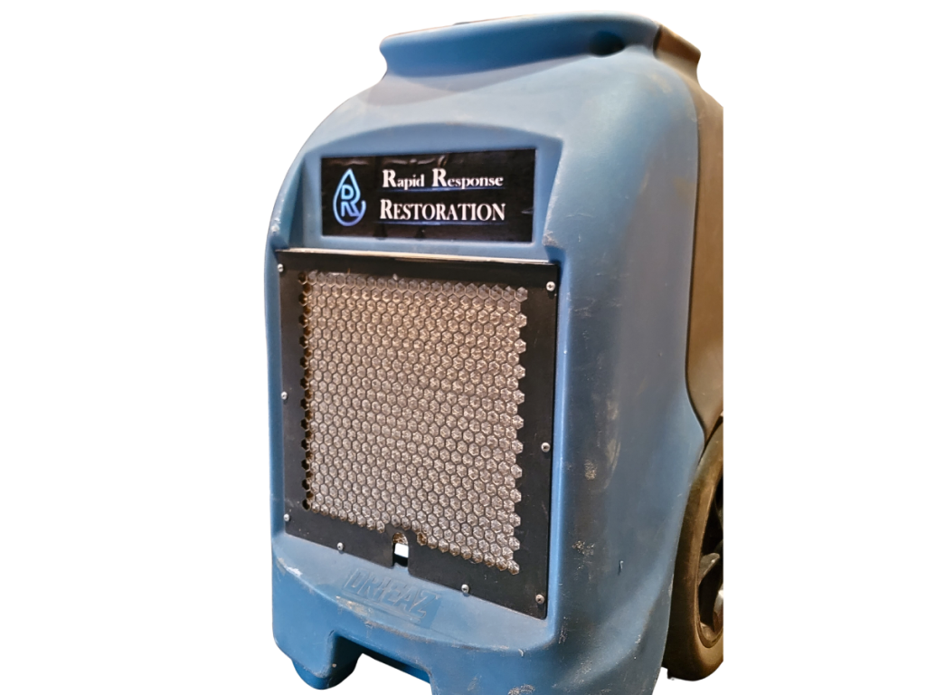 Close-up of a blue Rapid Response Restoration dehumidifier, used for indoor air quality control and moisture removal, essential in water damage restoration and mold remediation processes.