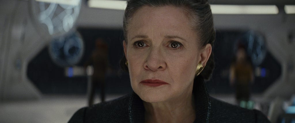 Close-up on General Leia Organa as she contemplates the dire straights of the Resistance in The Last Jedi.