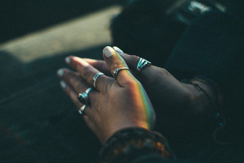 hand palms are closed to one another as one is praying