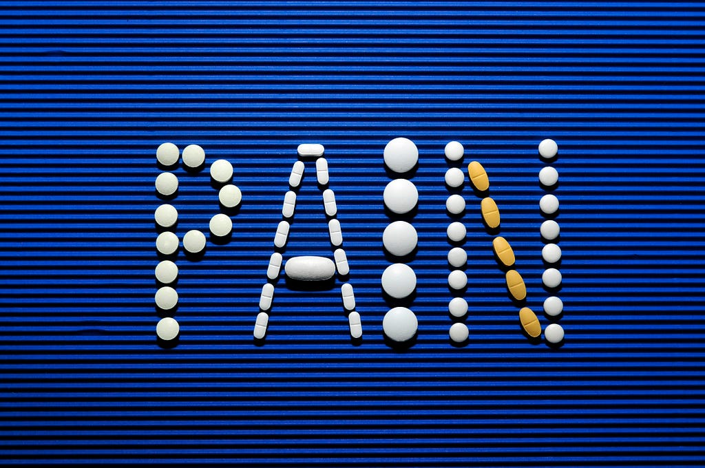 Using pills to make the word “PAIN”