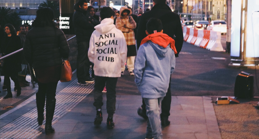 Young people in street wearing ASSC gear.