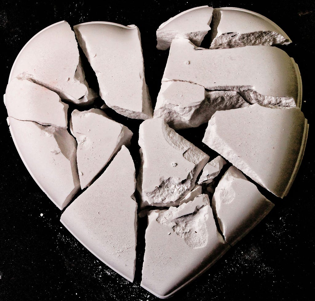 A white colored heart in pieces