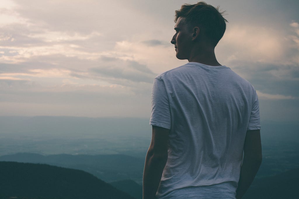 man staring into the scenery