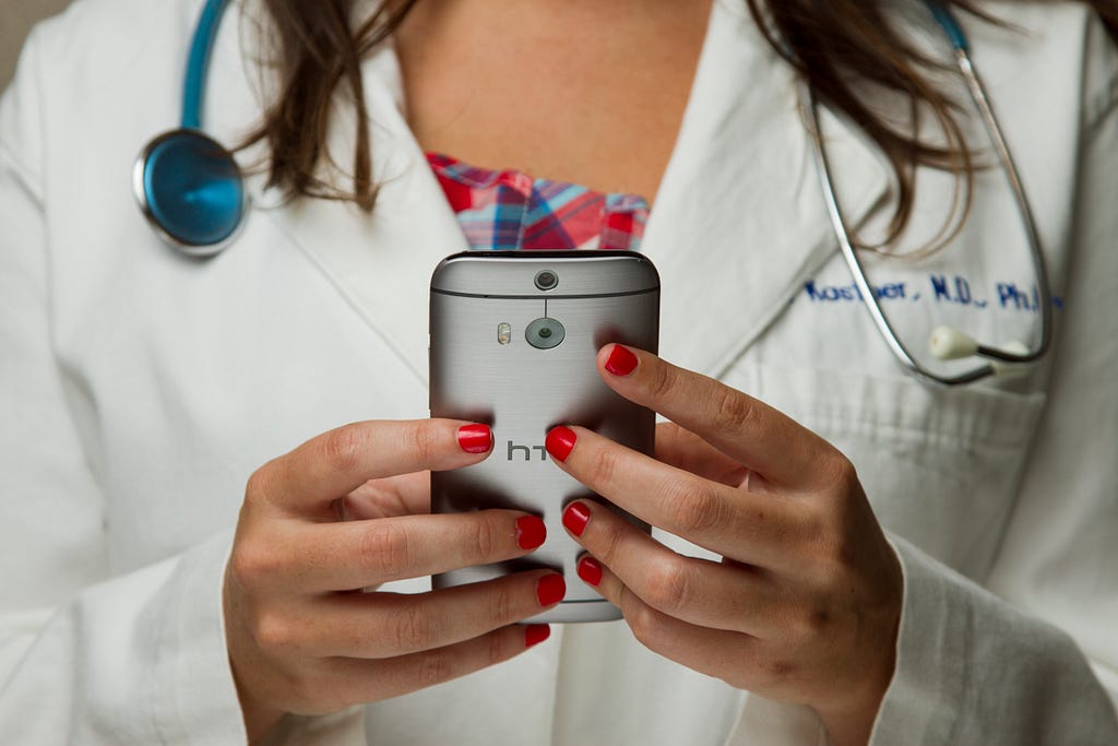 A doctor using a smartphone.