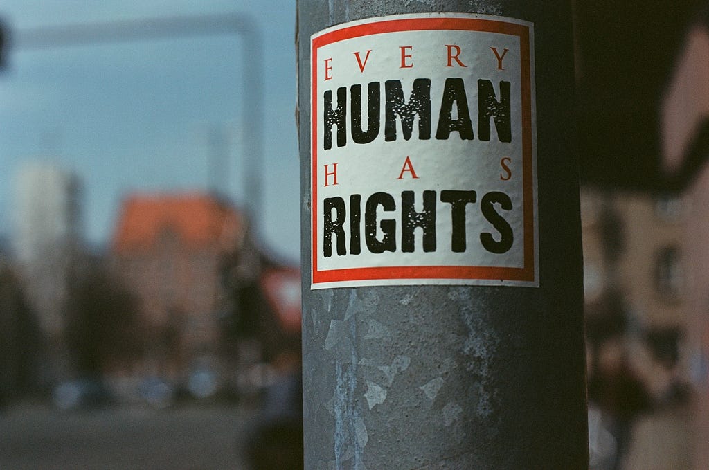 Sticker saying ‘every human has rights’.