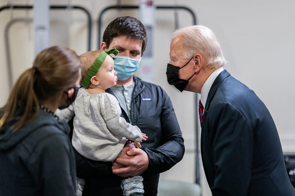 President Joe Biden greets Ret. U.S. Marine Cpl. William Kiernan, his wife Leah, and their daughter Madison, on Jan. 29, 2021, during a visit to Walter Reed National Military Medical Center in Bethesda, Maryland.