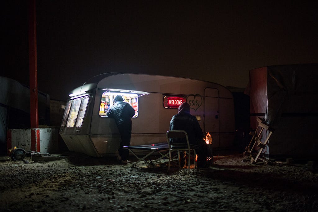  In this squalid encampment outside Calais, where food security is in jeopardy, refugees survive on donations cooked in communal kitchens or distributed by grassroots volunteer organizations striving to provide enough to eat.