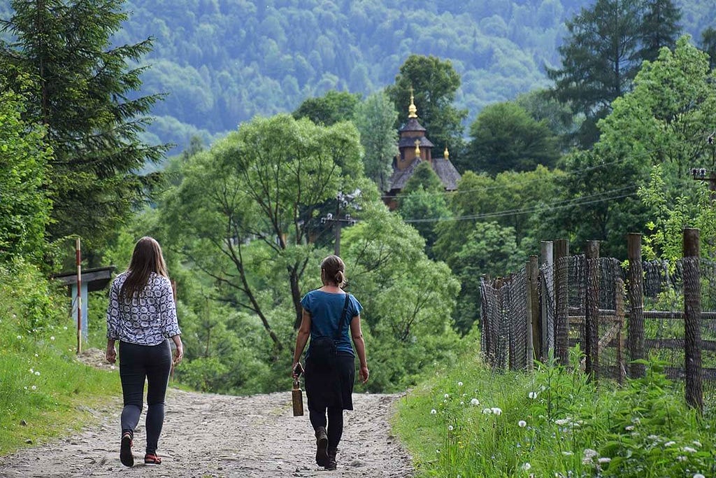 Darcy and her friend Anastacia walking toward Lypa, Western Ukraine