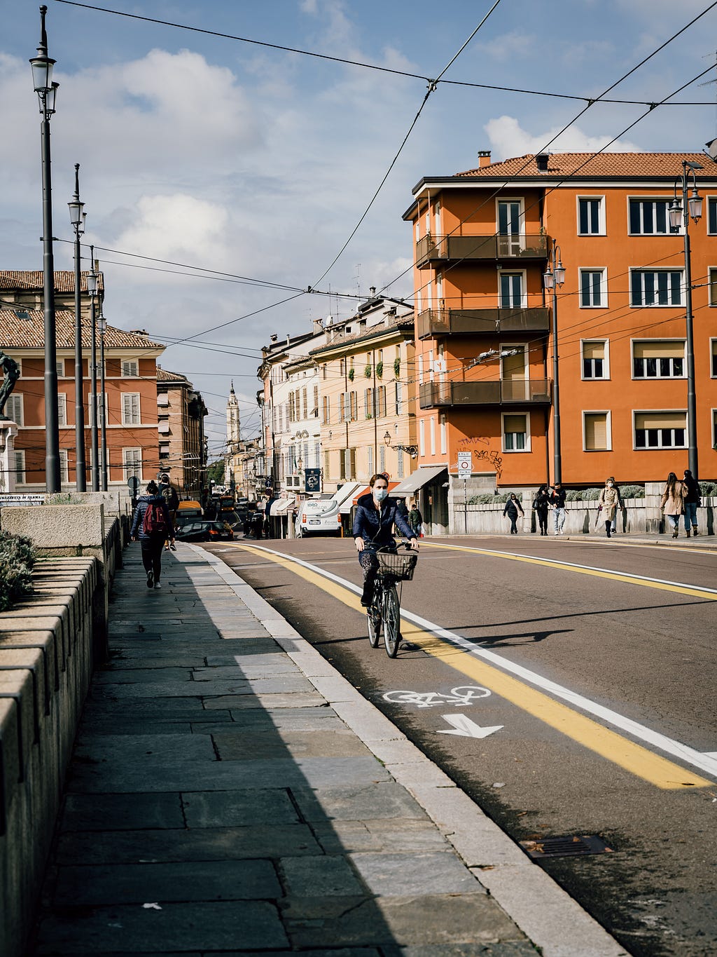 a woman riding in a bike lane