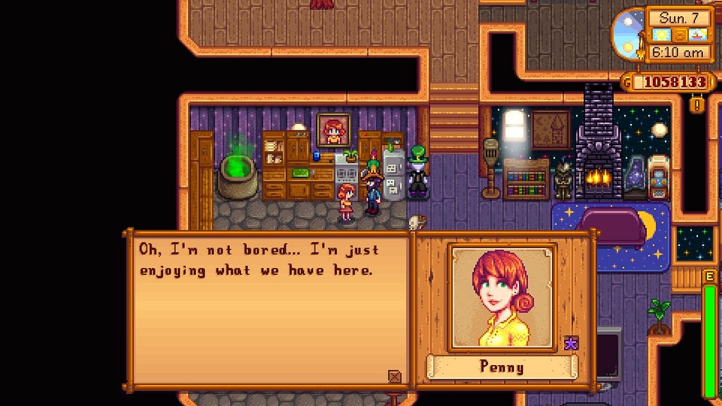 In-game image of my character talking to Penny in our home, filled with furniture and decoration. The conversation is taking place in the kitchen. In the text box she’s saying “Oh, I’m not bored…I’m just enjoying what we have here.” The text box also shows the relationship is Iridium star quality.