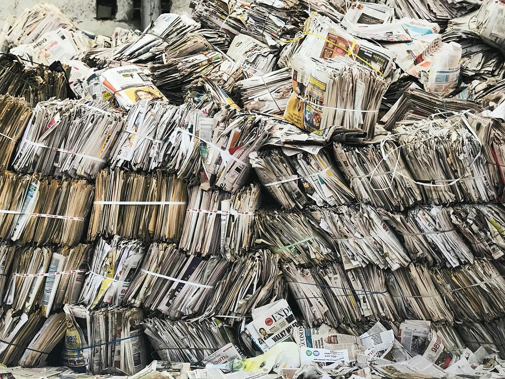 Newspapers stacked neatly on top of each other