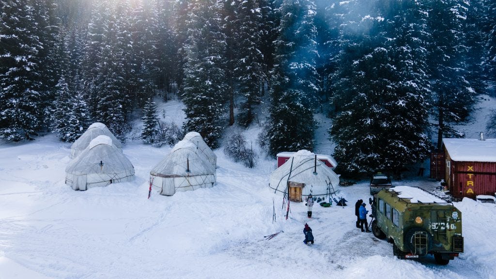 Yurts in the winter forest | Travel Land |