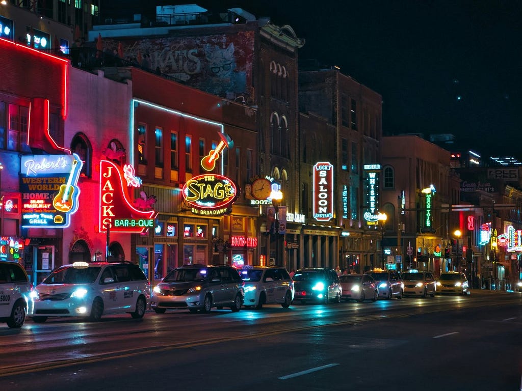 City Breaks Explorer — Nashville Weekend Guide — Top 10 Must-Do Experiences — Nashville Broadway Honky Tonk Line of Bars at Night