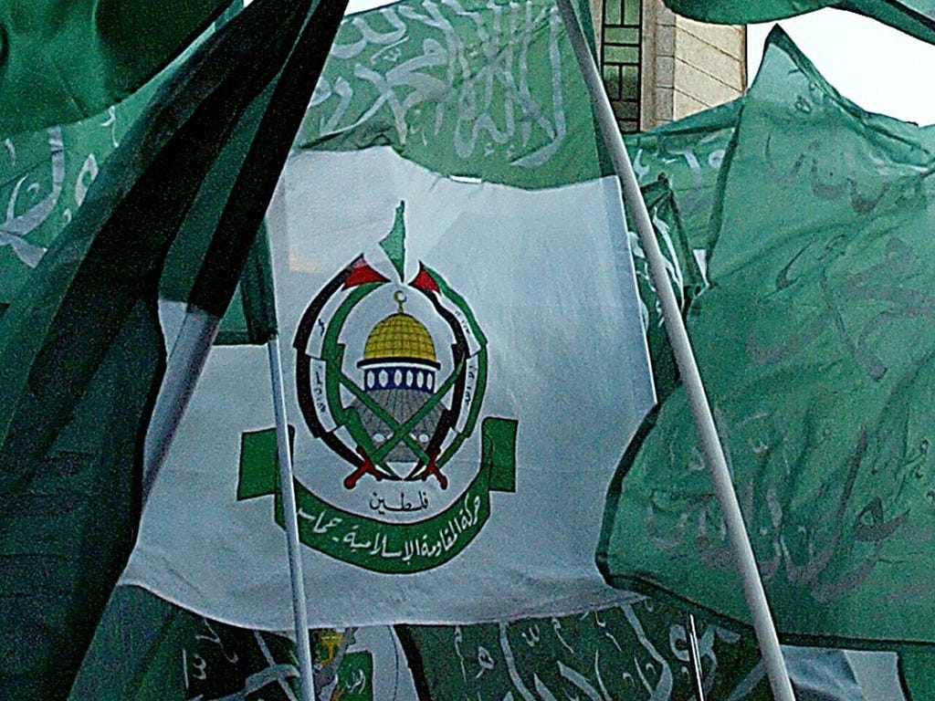 A picture of consisting of multiple Hamas flags with the Shahada, the Muslim Declaration of Faith on them.