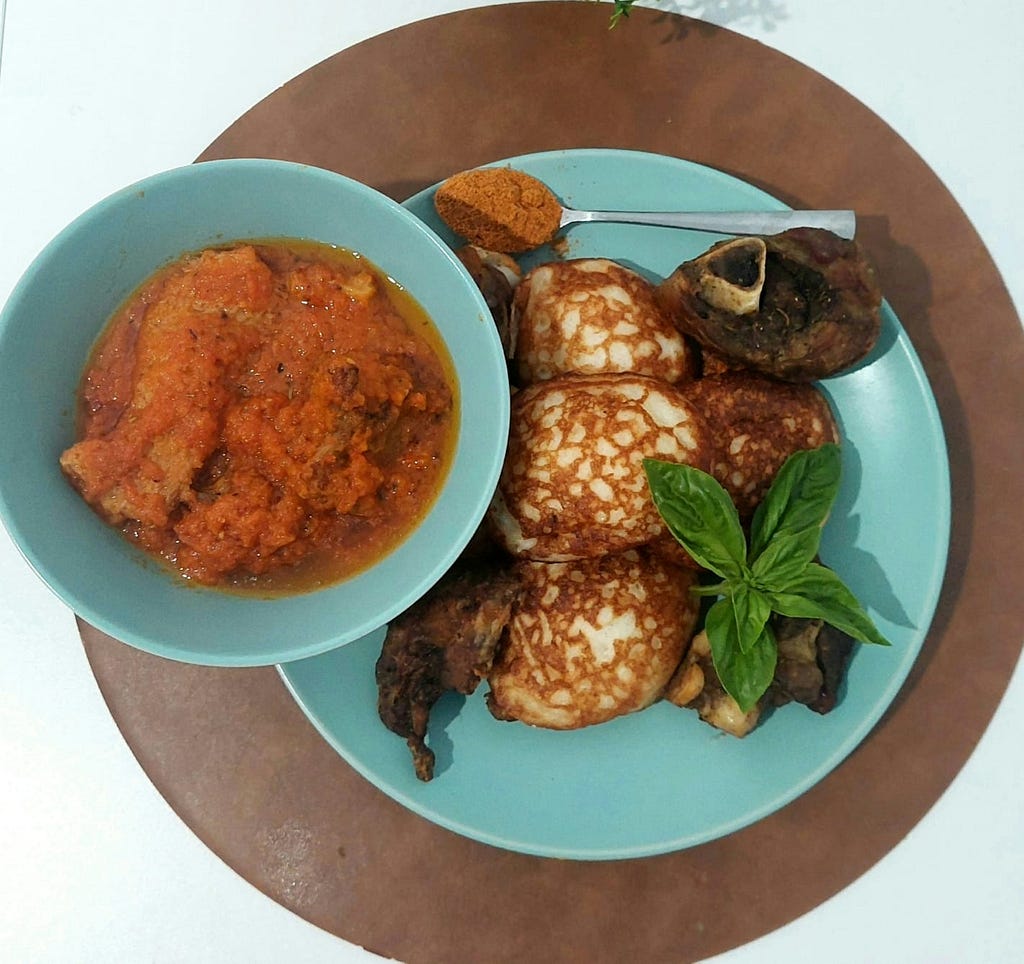 Masa served with grilled lamb and stew.